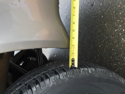 Driver's side, 2.5&quot; from tire to rear of wheel arch